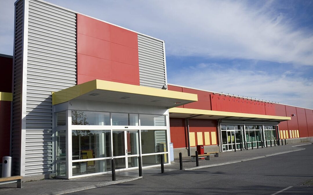 Orange and silver metal building completed for a storage unit.
