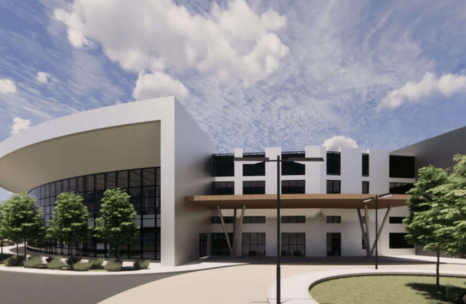 Developed construction of a steel building featuring a dome and glass panels on its perimeter.